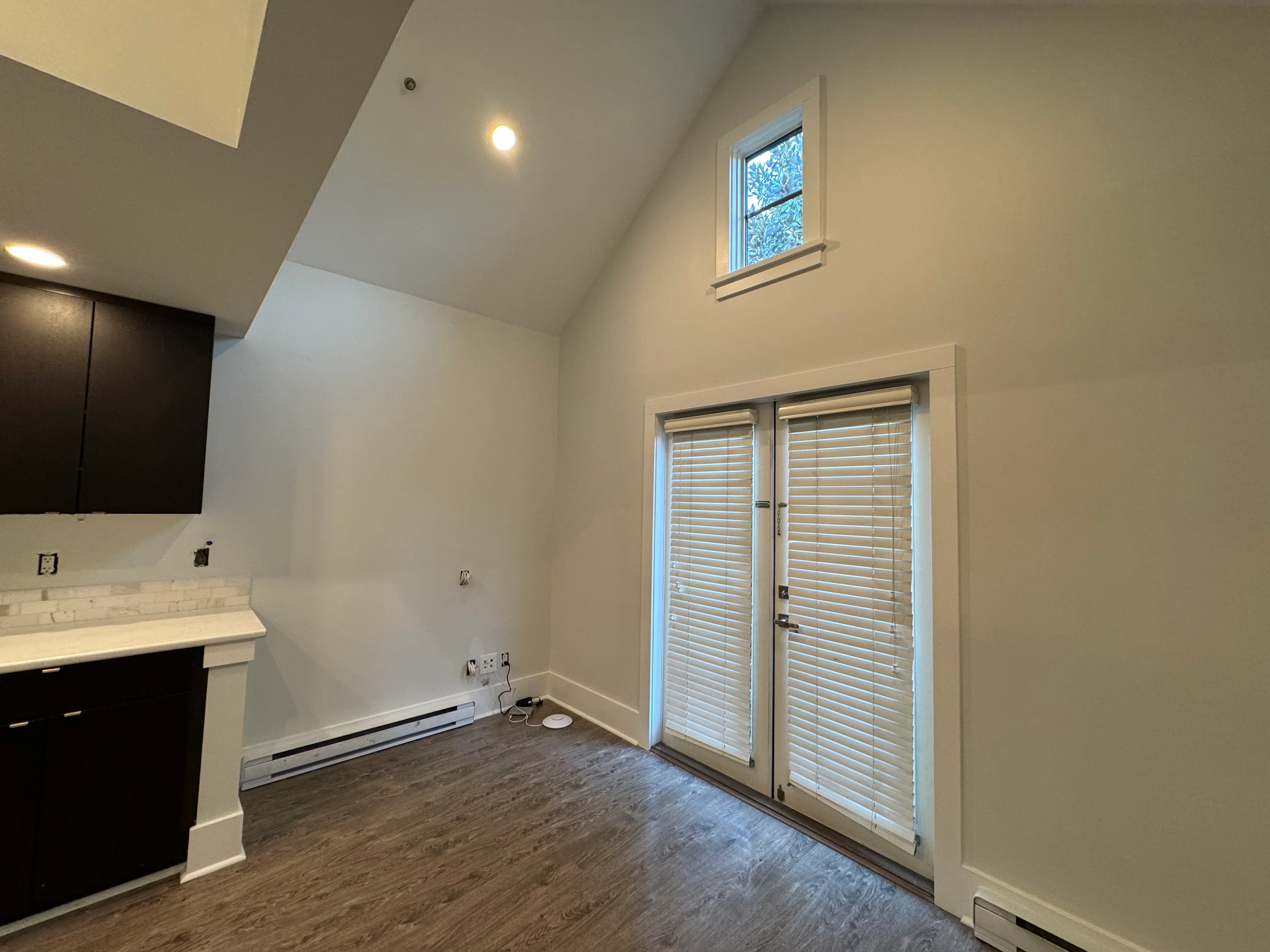 Vaulted living area with french doors to the patio